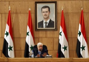 Syrian Foreign Minister Walid al-Moualem talks during a news conference in Damascus