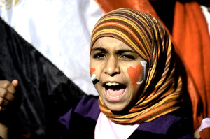 An Egyptian girl shouts slogans against